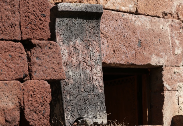 An intricately carved Armenian khachkar (cross-stone) near Byurakan, Armenia